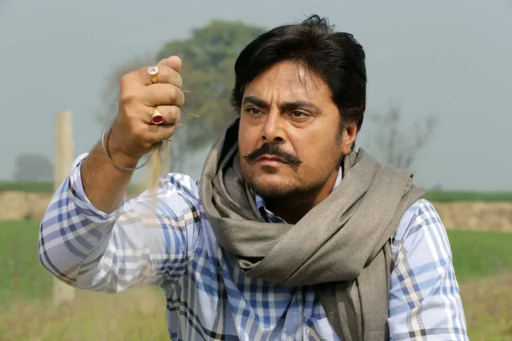 Guggu Gill sitting in farm shareek movie 
