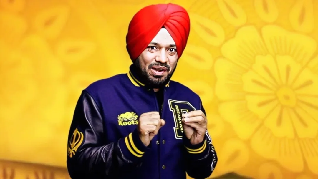 Gurpreet Ghuggi wearing blue jacket and red turban