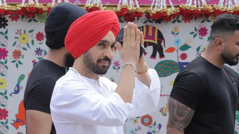 diljit dosanjh in white kurta and red turban in ambani wedding