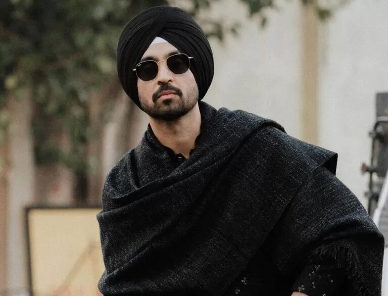 diljit dosanjh wearing black shades and black kurta pajama